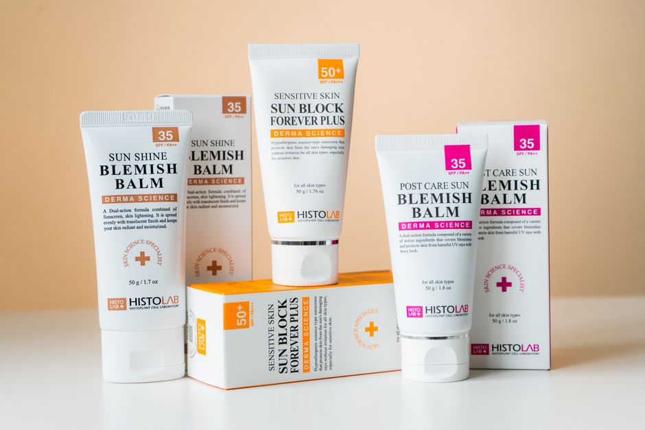 A collection of skincare products including blemish balms and sunblock for sensitive skin with SPF protection.