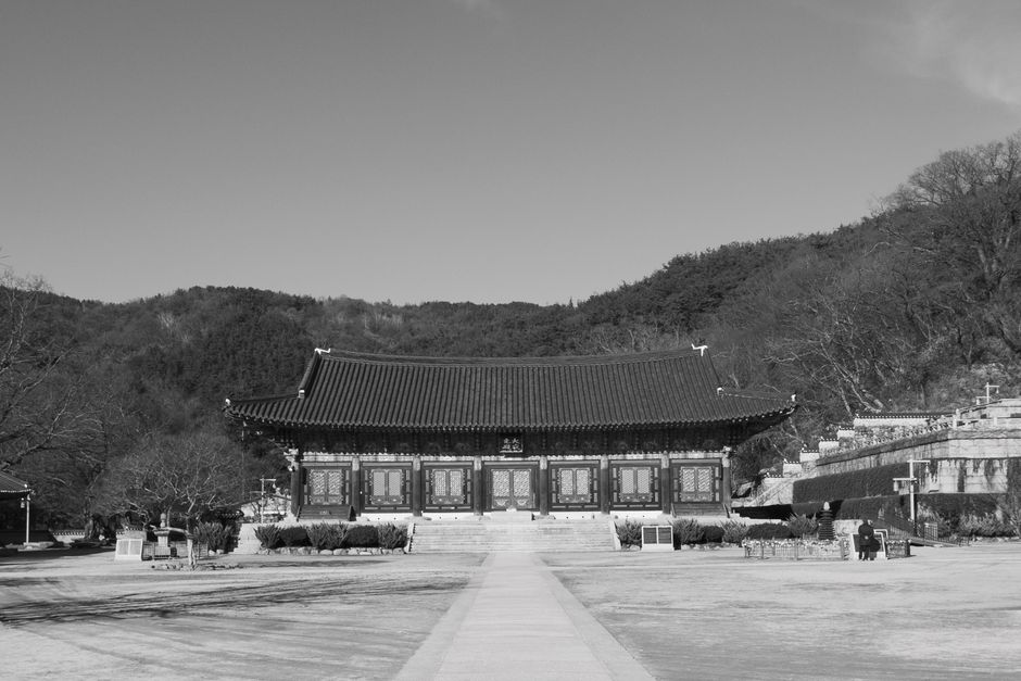 Black and white photo of an Asian temple showcasing traditional architecture.